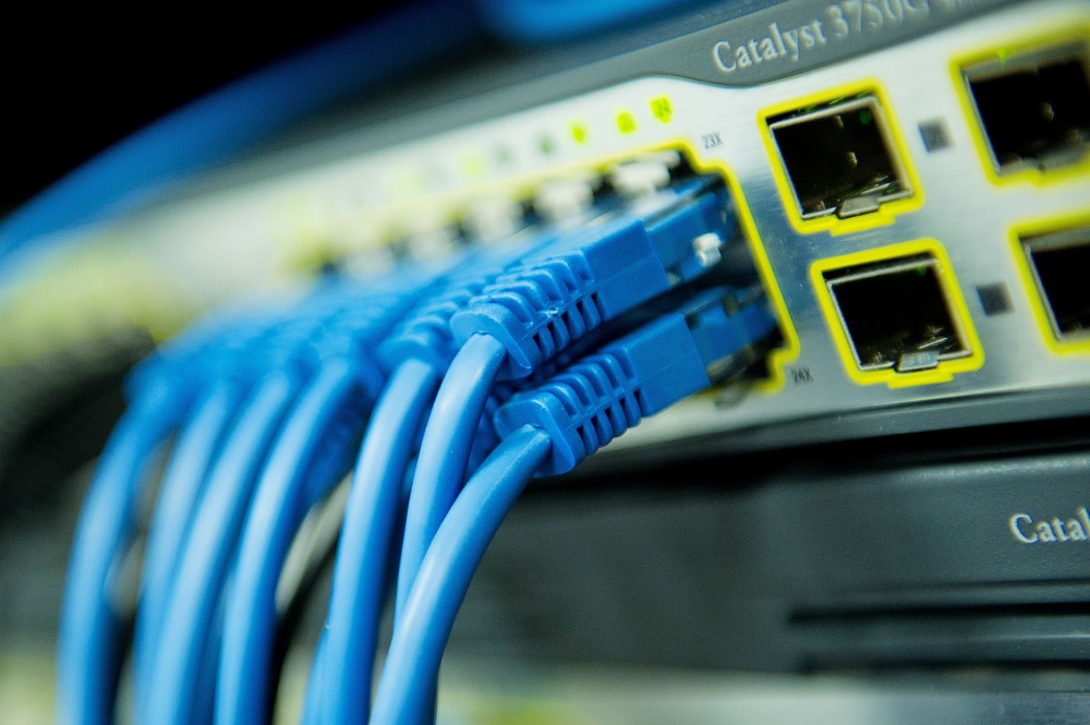 Blue cables at the back of a computer hard drive